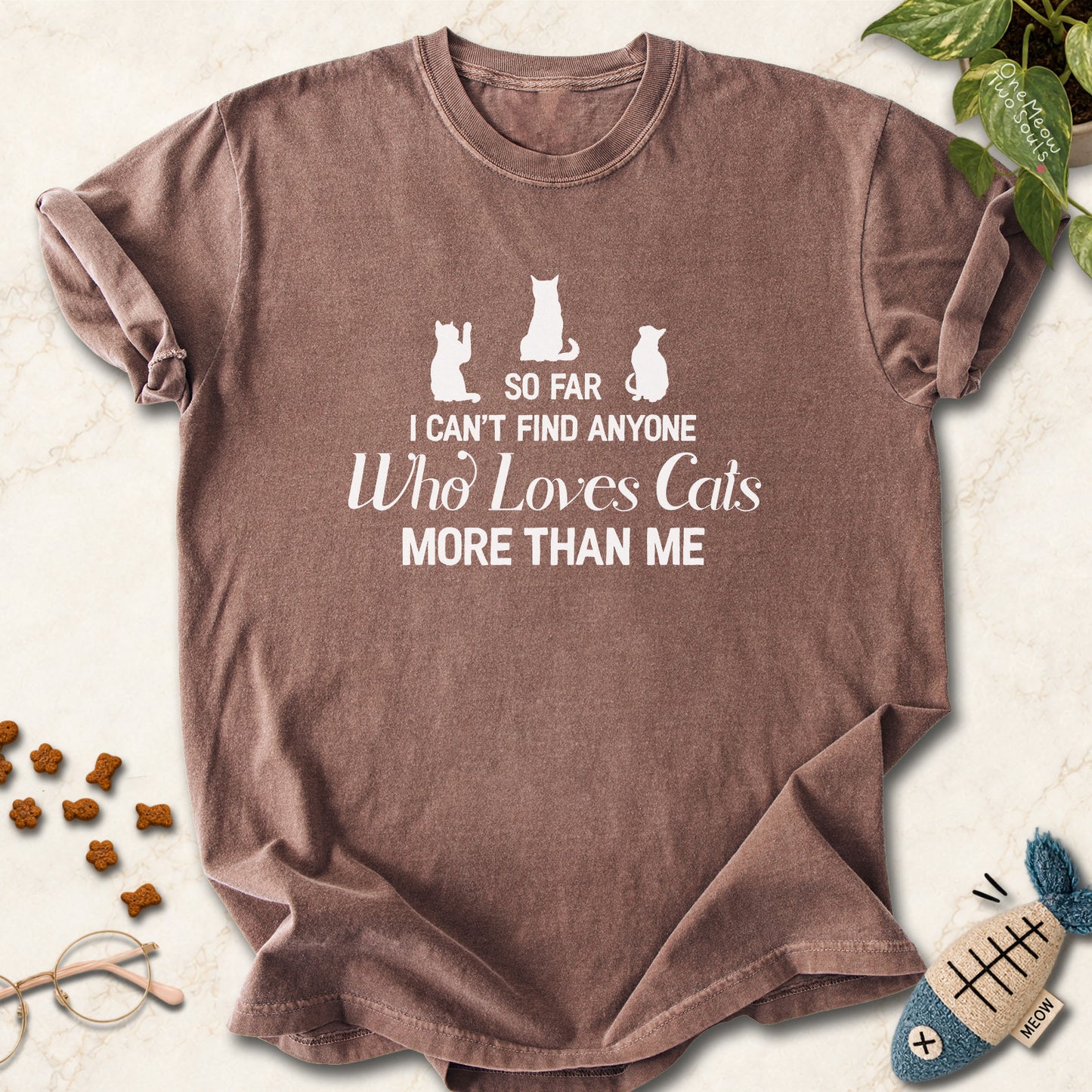 Espresso colored Comfort Colors 1717 cotton T-shirt, featuring a "So I can't find anyone who loves cats more than me" funny cat design illustration. One Meow Two Souls brand.