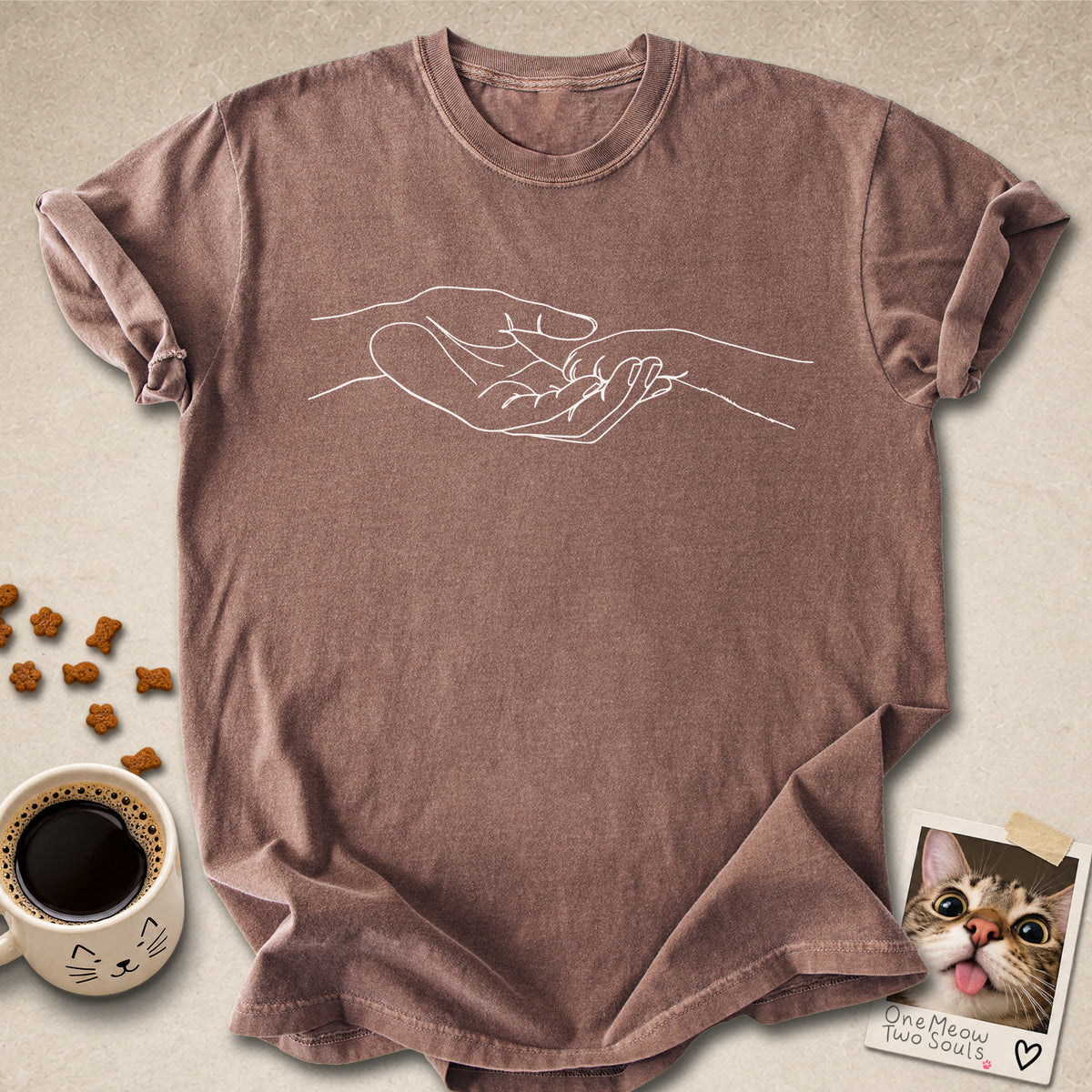 Espresso colored Comfort Colors 1717 cotton T-shirt, featuring a cute cat paw and human hand design illustration. One Meow Two Souls brand.