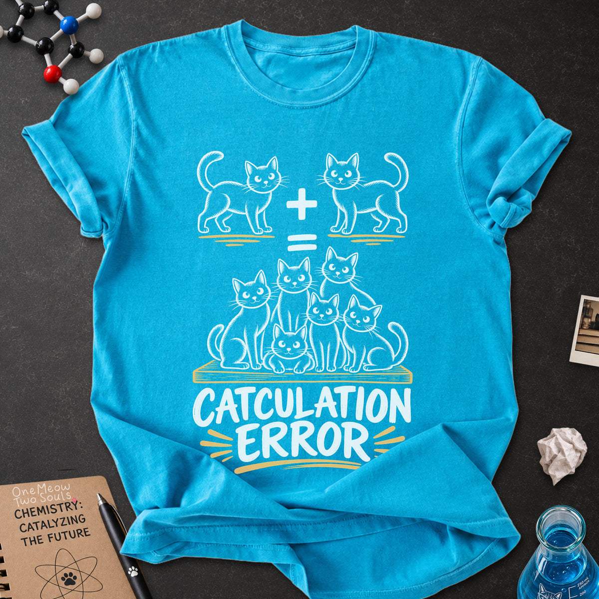 Sapphire colored Comfort Colors 1717 cotton T-shirt, featuring a "Catculation Error" funny cat design illustration. One Meow Two Souls brand.