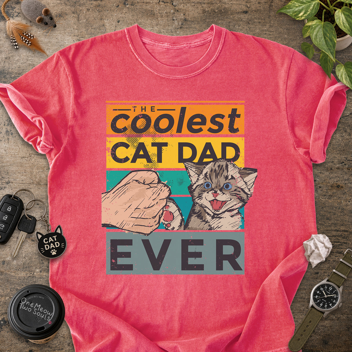 Watermelon colored Comfort Colors 1717 T-shirt with a "The Coolest Cat Dad Ever" colorful retro design. One Meow Two Souls brand.