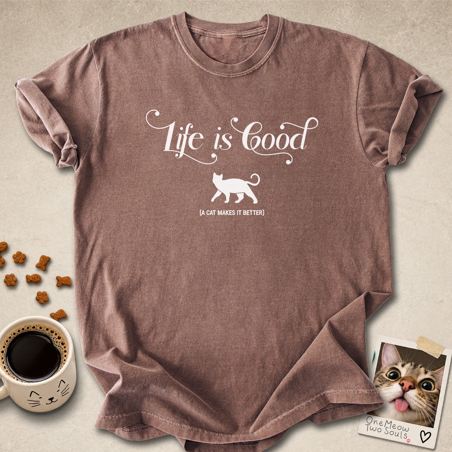 Espresso colored Comfort Colors 1717 cotton T-shirt, featuring a "Life is good. A cat makes it better" funny cat design illustration. One Meow Two Souls brand.