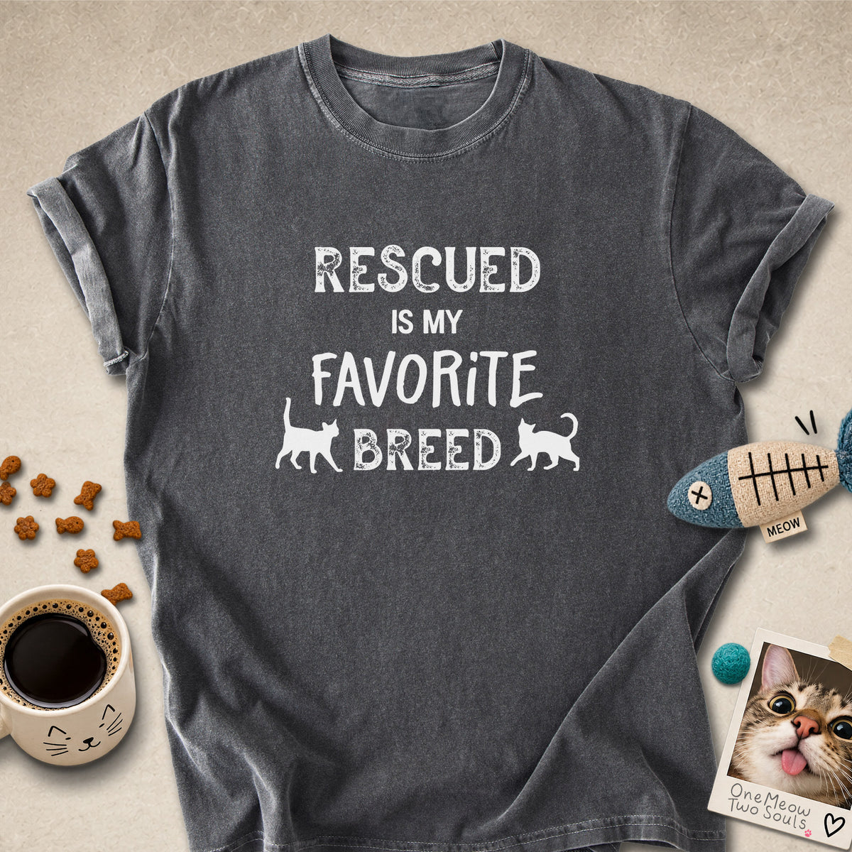 Pepper colored Comfort Colors 1717 cotton T-shirt, featuring a "Rescued is my favorite breed" funny cat design. One Meow Two Souls brand.