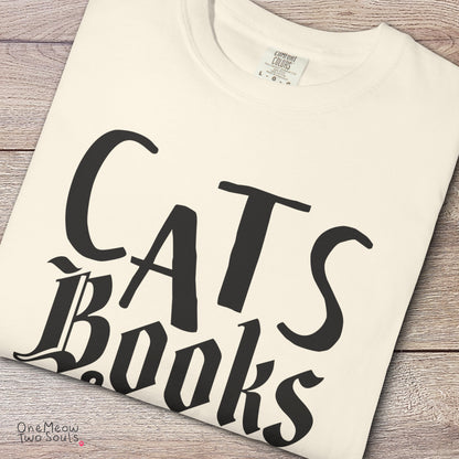Ivory colored Comfort Colors 1717 cotton T-shirt, featuring a "Cats, Books & Coffee" funny cat design illustration. One Meow Two Souls brand.