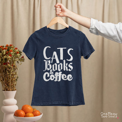 Navy colored Comfort Colors 1717 cotton T-shirt, featuring a "Cats, Books & Coffee" funny cat design illustration. One Meow Two Souls brand.