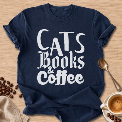 Navy colored Comfort Colors 1717 cotton T-shirt, featuring a "Cats, Books & Coffee" funny cat design illustration. One Meow Two Souls brand.