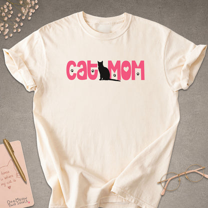 Ivory colored Comfort Colors 1717 cotton T-shirt, featuring a "Cat Mom" cute cat design illustration. One Meow Two Souls brand.