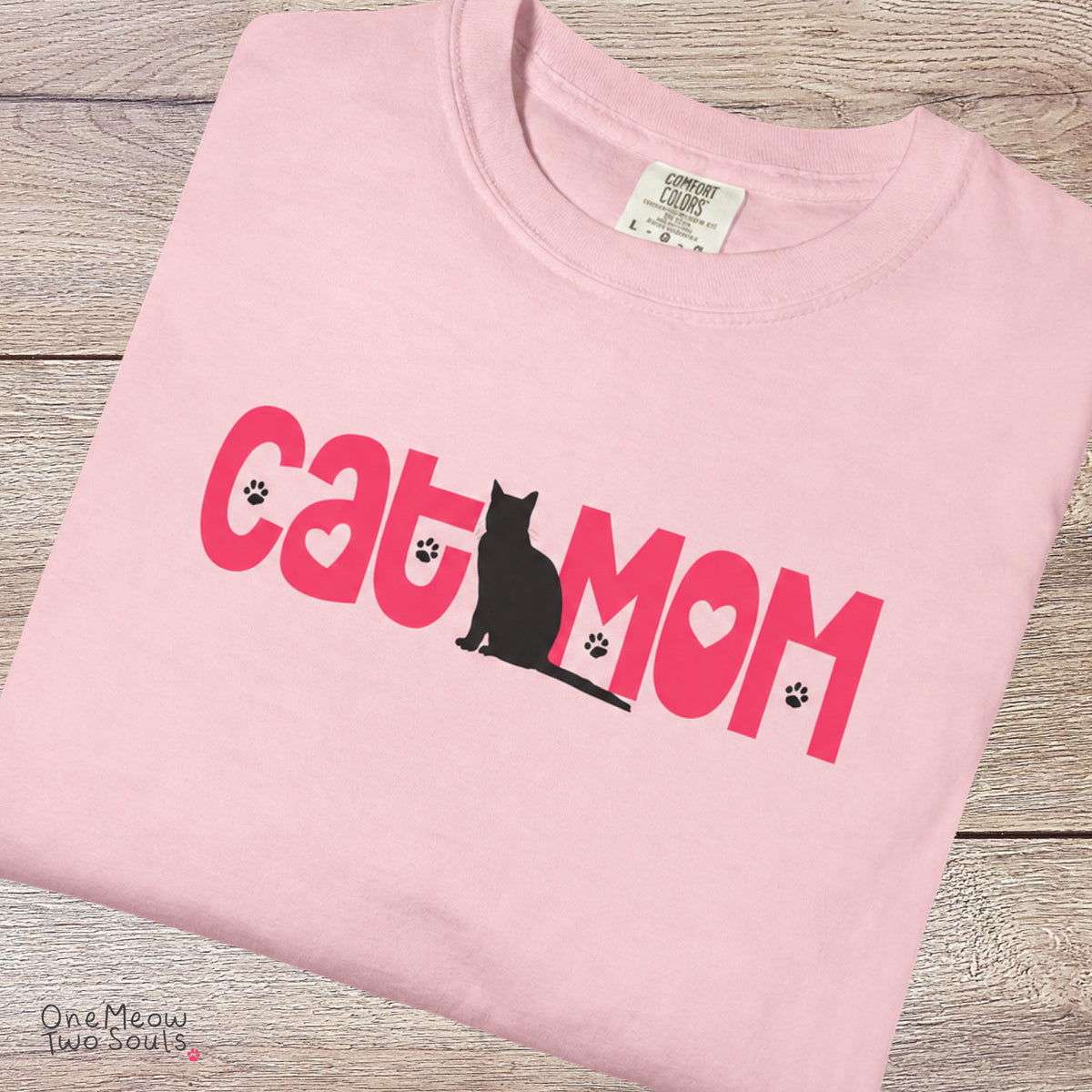 Blossom colored Comfort Colors 1717 cotton T-shirt, featuring a "Cat Mom" cute cat design illustration. One Meow Two Souls brand.