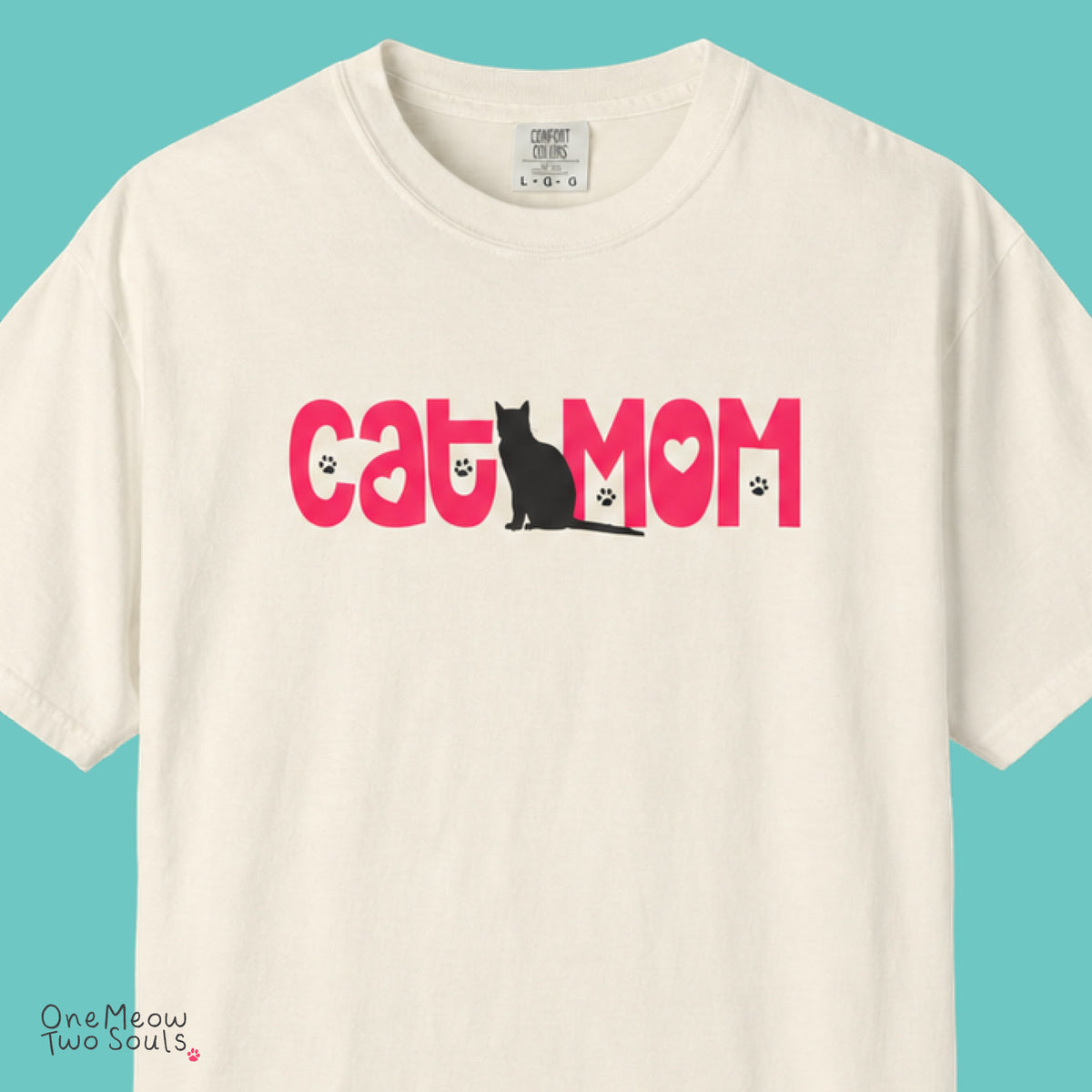 Ivory colored Comfort Colors 1717 cotton T-shirt, featuring a "Cat Mom" cute cat design illustration. One Meow Two Souls brand.