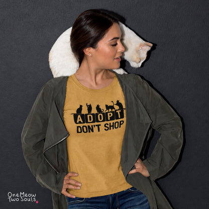 Mustard colored Comfort Colors 1717 cotton T-shirt, featuring a "Adopt Don't Shop" funny cat design illustration. One Meow Two Souls brand.