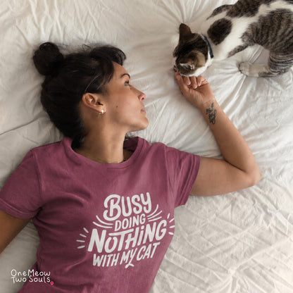 Berry colored Comfort Colors 1717 cotton T-shirt, featuring a "Busy doing nothing with my cat" funny cat design illustration. One Meow Two Souls brand.