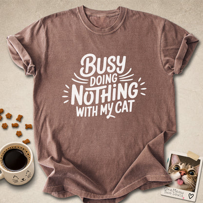 Espresso colored Comfort Colors 1717 cotton T-shirt, featuring a "Busy doing nothing with my cat" funny cat design illustration. One Meow Two Souls brand.