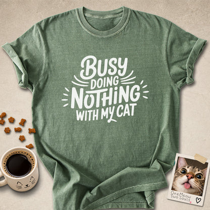 Moss colored Comfort Colors 1717 cotton T-shirt, featuring a "Busy doing nothing with my cat" funny cat design illustration. One Meow Two Souls brand.
