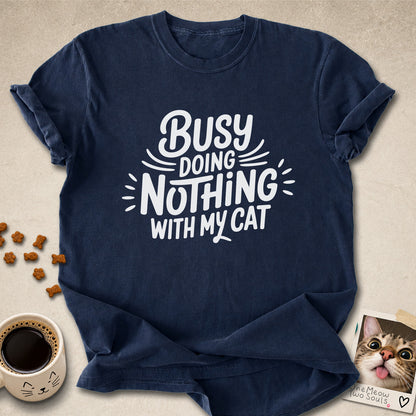Navy colored Comfort Colors 1717 cotton T-shirt, featuring a "Busy doing nothing with my cat" funny cat design illustration. One Meow Two Souls brand.