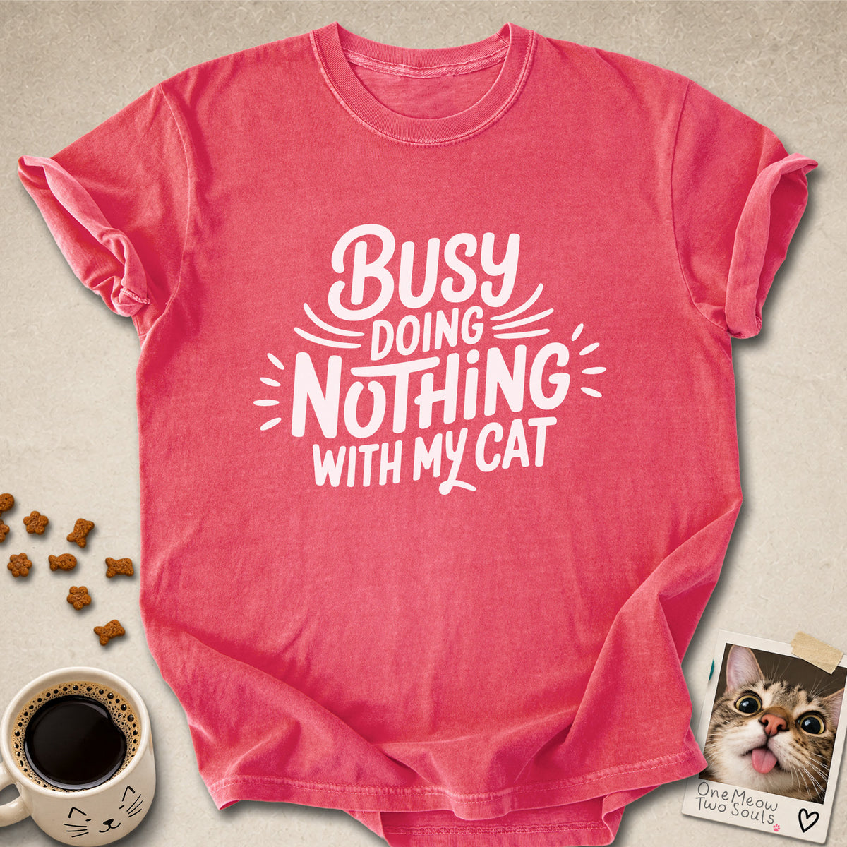 Watermelon colored Comfort Colors 1717 cotton T-shirt, featuring a "Busy doing nothing with my cat" funny cat design illustration. One Meow Two Souls brand.