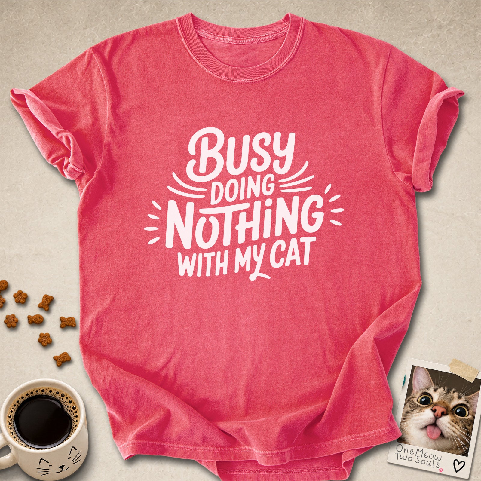 Watermelon colored Comfort Colors 1717 cotton T-shirt, featuring a "Busy doing nothing with my cat" funny cat design illustration. One Meow Two Souls brand.