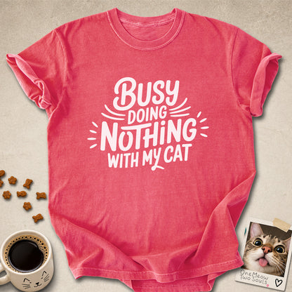 Watermelon colored Comfort Colors 1717 cotton T-shirt, featuring a "Busy doing nothing with my cat" funny cat design illustration. One Meow Two Souls brand.