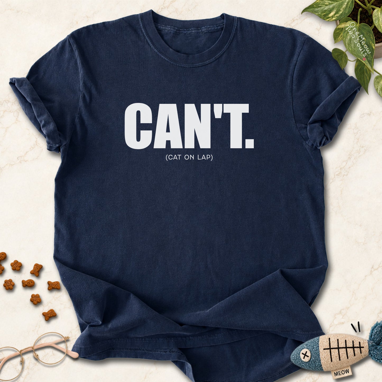 Navy colored Comfort Colors 1717 cotton T-shirt, featuring a "Can't. (cat on lap)" funny cat design illustration. One Meow Two Souls brand.
