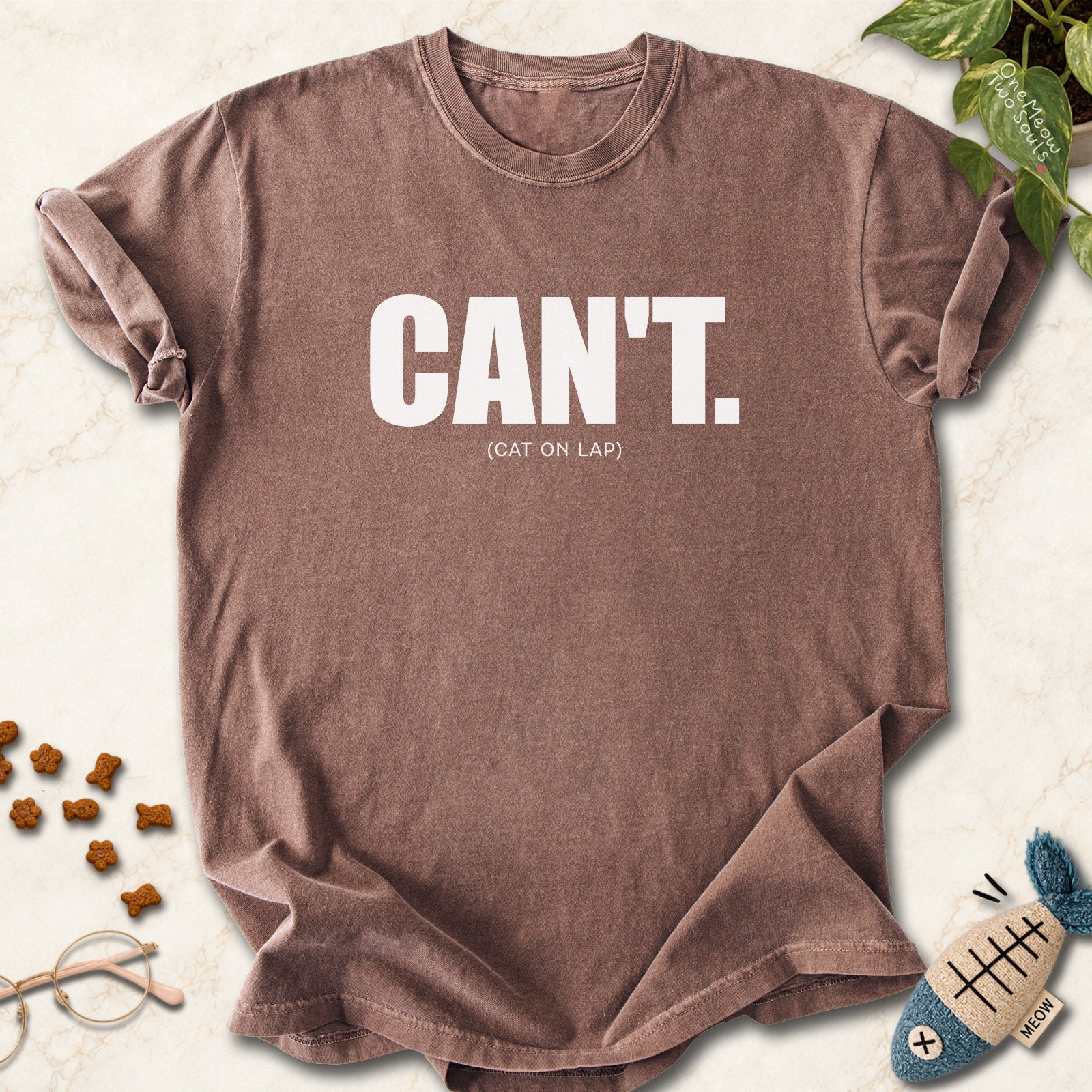 Espresso colored Comfort Colors 1717 cotton T-shirt, featuring a "Can't. (cat on lap)" funny cat design illustration. One Meow Two Souls brand.