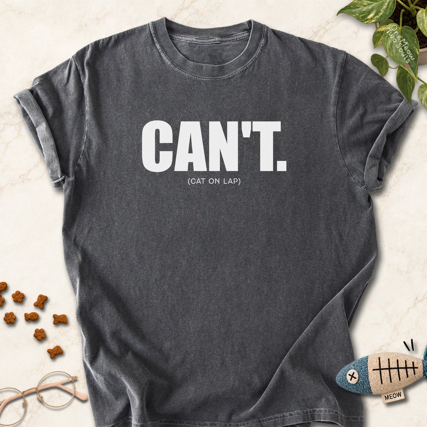 Pepper colored Comfort Colors 1717 cotton T-shirt, featuring a "Can't. (cat on lap)" funny cat design illustration. One Meow Two Souls brand.
