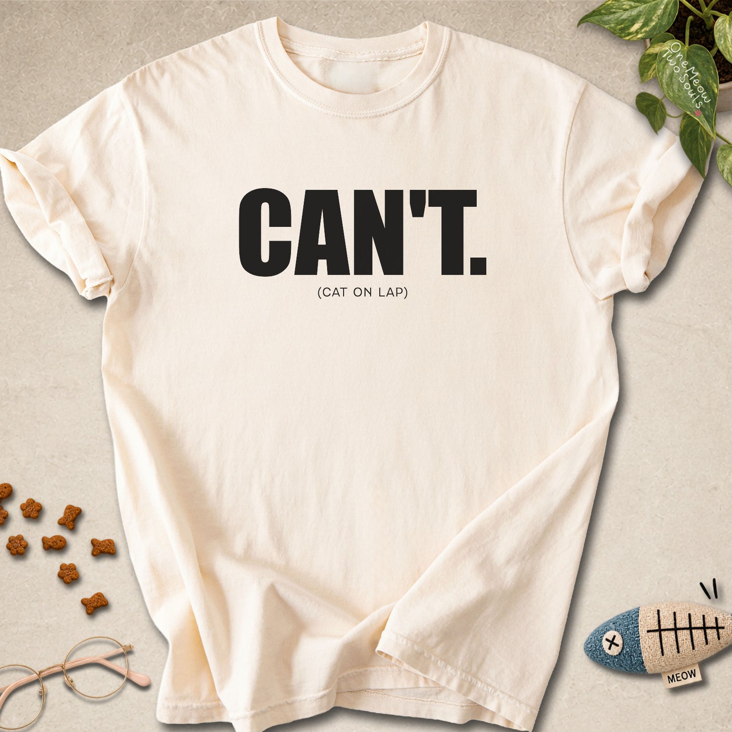 Ivory colored Comfort Colors 1717 cotton T-shirt, featuring a "Can't. (cat on lap)" funny cat design illustration. One Meow Two Souls brand.