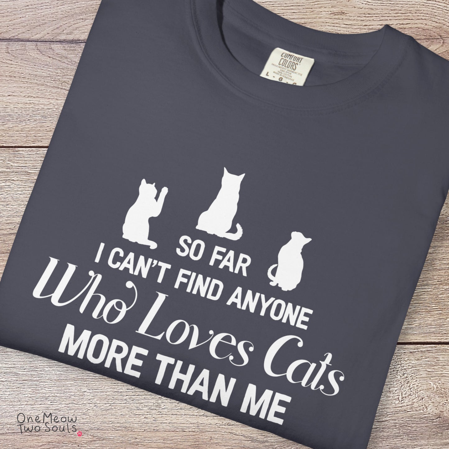 Navy colored Comfort Colors 1717 cotton T-shirt, featuring a "So I can't find anyone who loves cats more than me" funny cat design illustration. One Meow Two Souls brand.