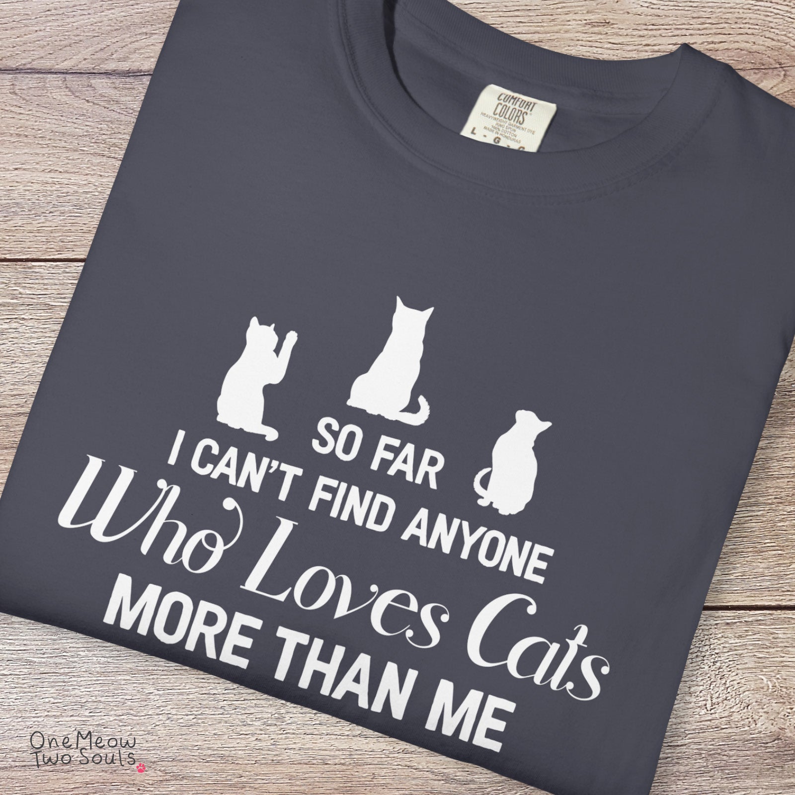Navy colored Comfort Colors 1717 cotton T-shirt, featuring a "So I can't find anyone who loves cats more than me" funny cat design illustration. One Meow Two Souls brand.
