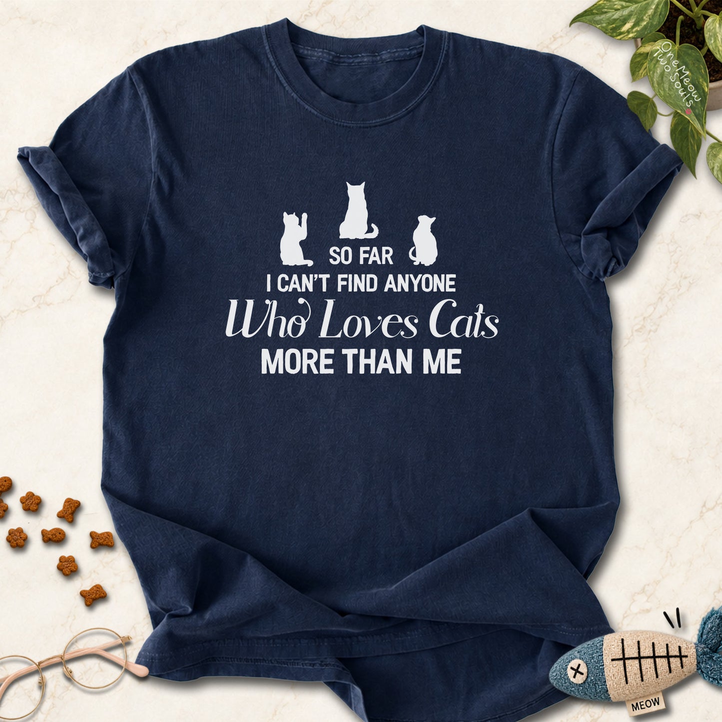 Navy colored Comfort Colors 1717 cotton T-shirt, featuring a "So I can't find anyone who loves cats more than me" funny cat design illustration. One Meow Two Souls brand.