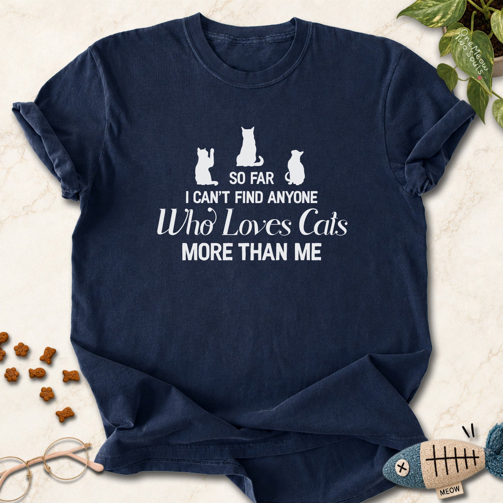 Navy colored Comfort Colors 1717 cotton T-shirt, featuring a "So I can't find anyone who loves cats more than me" funny cat design illustration. One Meow Two Souls brand.