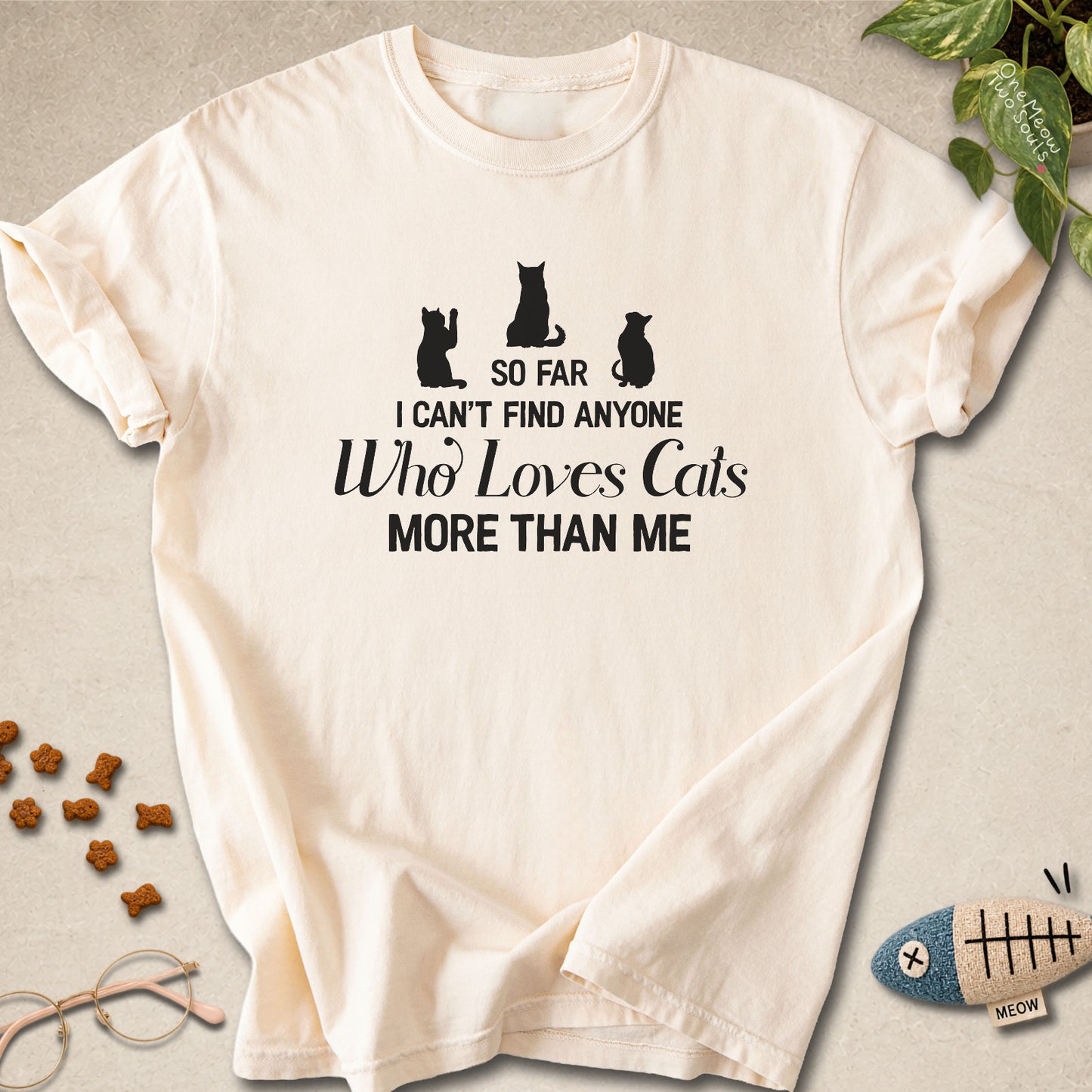 Ivory colored Comfort Colors 1717 cotton T-shirt, featuring a "So I can't find anyone who loves cats more than me" funny cat design illustration. One Meow Two Souls brand.