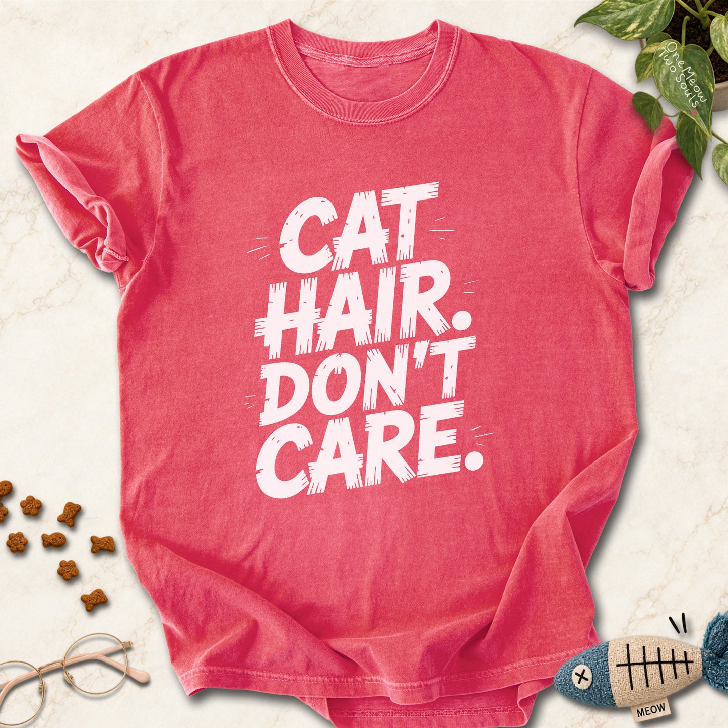 Watermelon colored Comfort Colors 1717 cotton T-shirt, featuring a "Cat Hair Don't Care" funny cat design illustration. One Meow Two Souls brand.