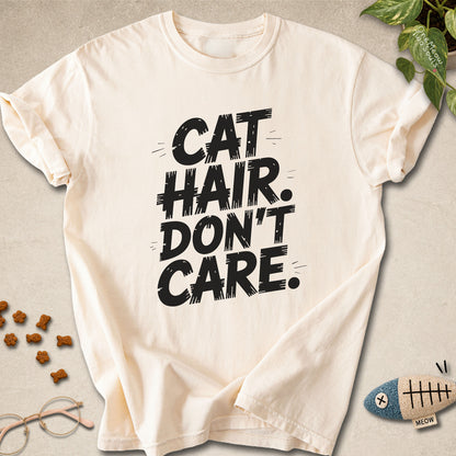 Ivory colored Comfort Colors 1717 cotton T-shirt, featuring a "Cat Hair Don't Care" funny cat design illustration. One Meow Two Souls brand.