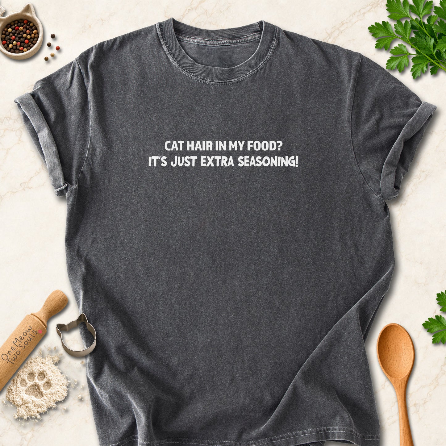 Pepper colored Comfort Colors 1717 cotton T-shirt, featuring a "Cat hair in my food? It's just extra seasoning" funny cat design illustration. One Meow Two Souls brand.
