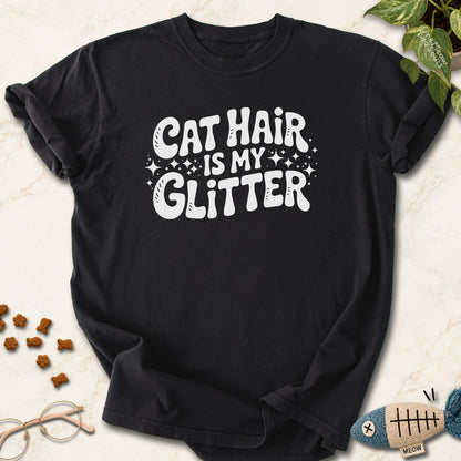 Black colored Comfort Colors 1717 cotton T-shirt, featuring a "Cat Hair Is My Glitter" funny cat design illustration. One Meow Two Souls brand.