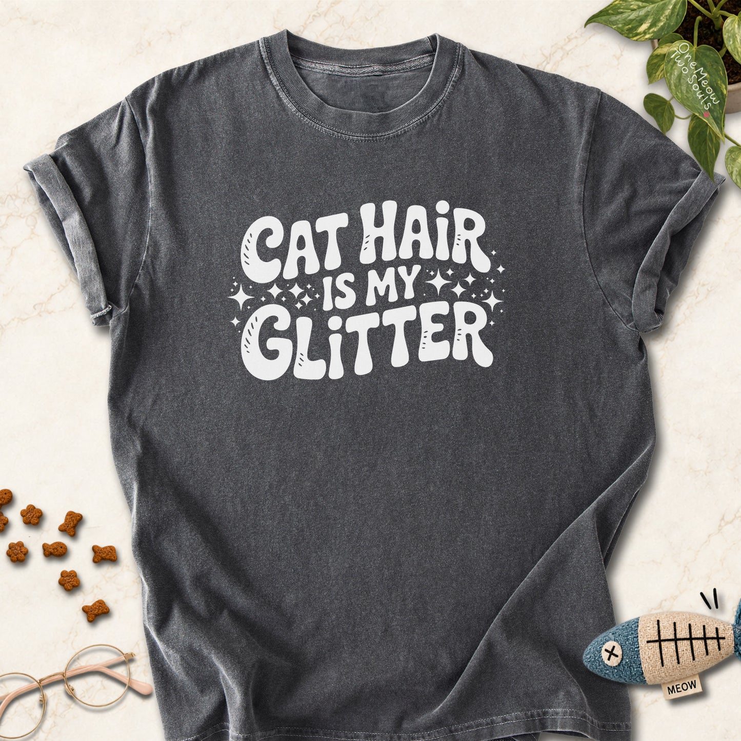 Pepper colored Comfort Colors 1717 cotton T-shirt, featuring a "Cat Hair Is My Glitter" funny cat design illustration. One Meow Two Souls brand.