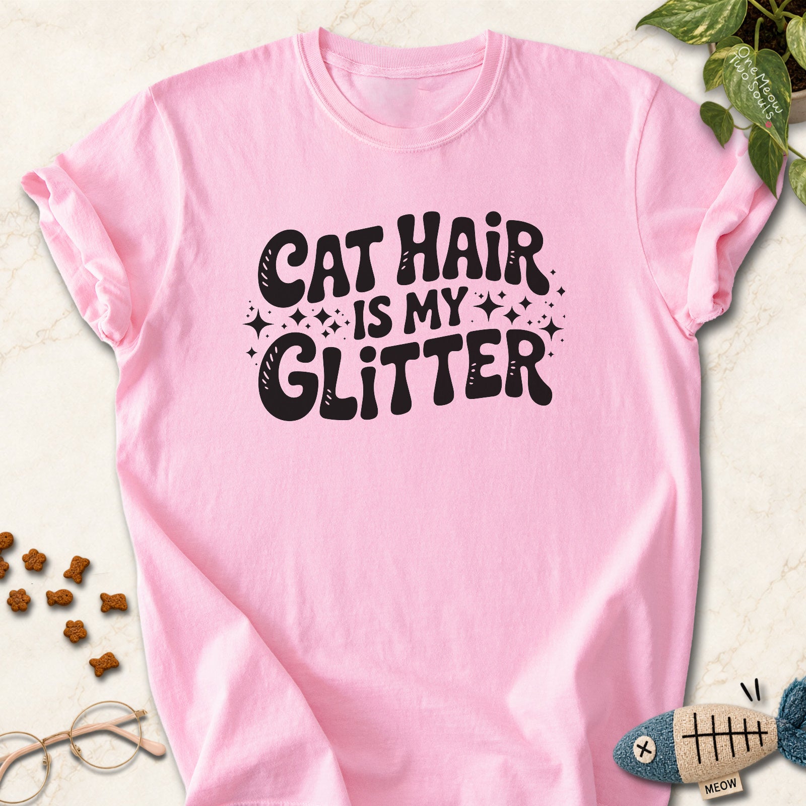 Blossom colored Comfort Colors 1717 cotton T-shirt, featuring a "Cat Hair Is My Glitter" funny cat design illustration. One Meow Two Souls brand.