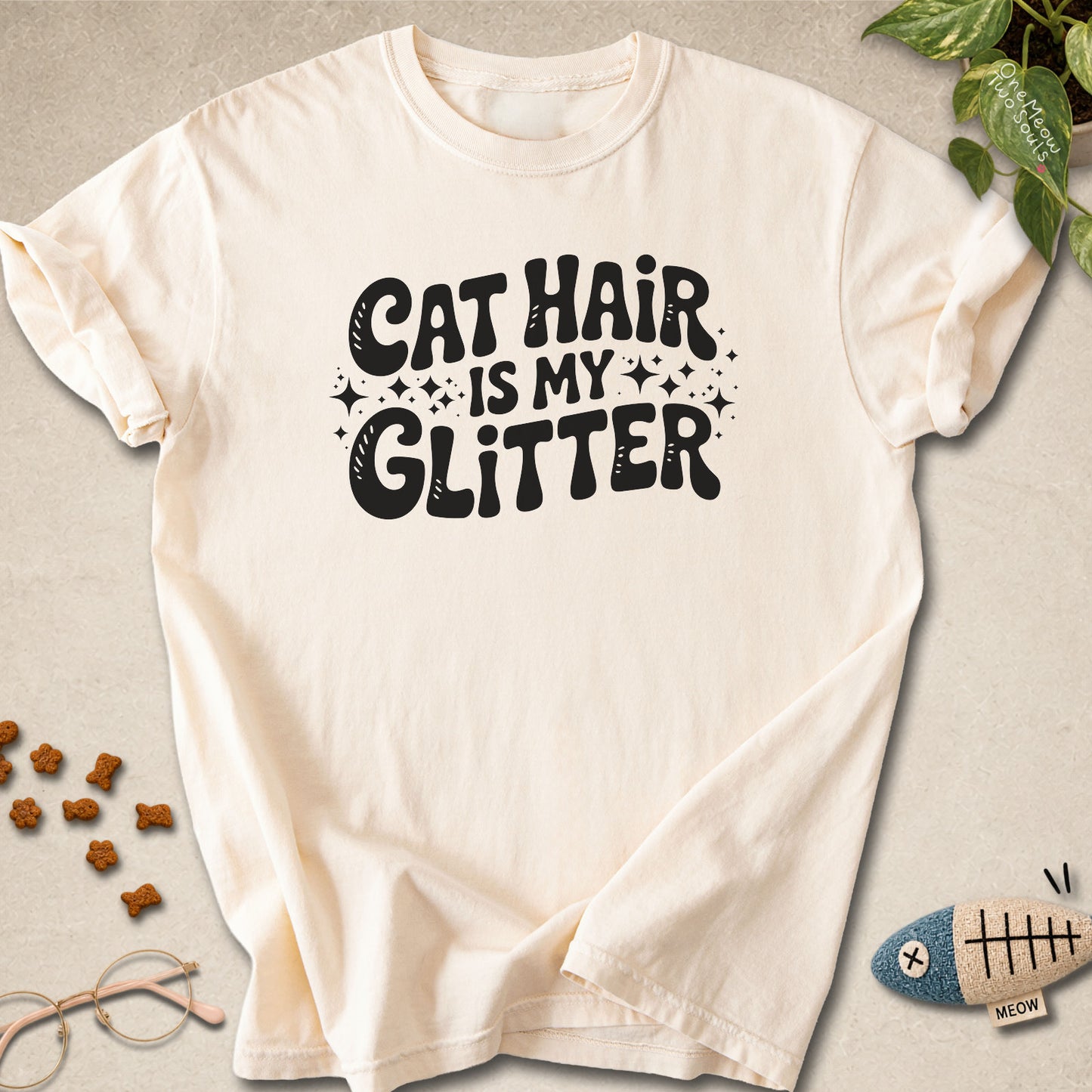 Ivory colored Comfort Colors 1717 cotton T-shirt, featuring a "Cat Hair Is My Glitter" funny cat design illustration. One Meow Two Souls brand.