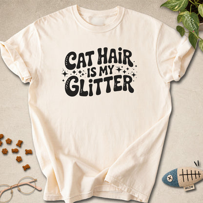 Ivory colored Comfort Colors 1717 cotton T-shirt, featuring a "Cat Hair Is My Glitter" funny cat design illustration. One Meow Two Souls brand.