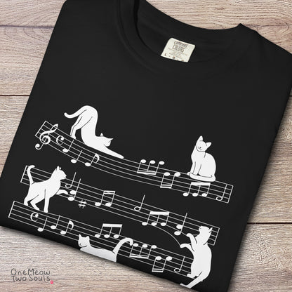 Black colored Comfort Colors 1717 cotton T-shirt, featuring a Cat music sheet funny cat design illustration. One Meow Two Souls brand.