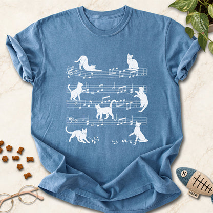 Blue Jean colored Comfort Colors 1717 cotton T-shirt, featuring a Cat music sheet funny cat design illustration. One Meow Two Souls brand.