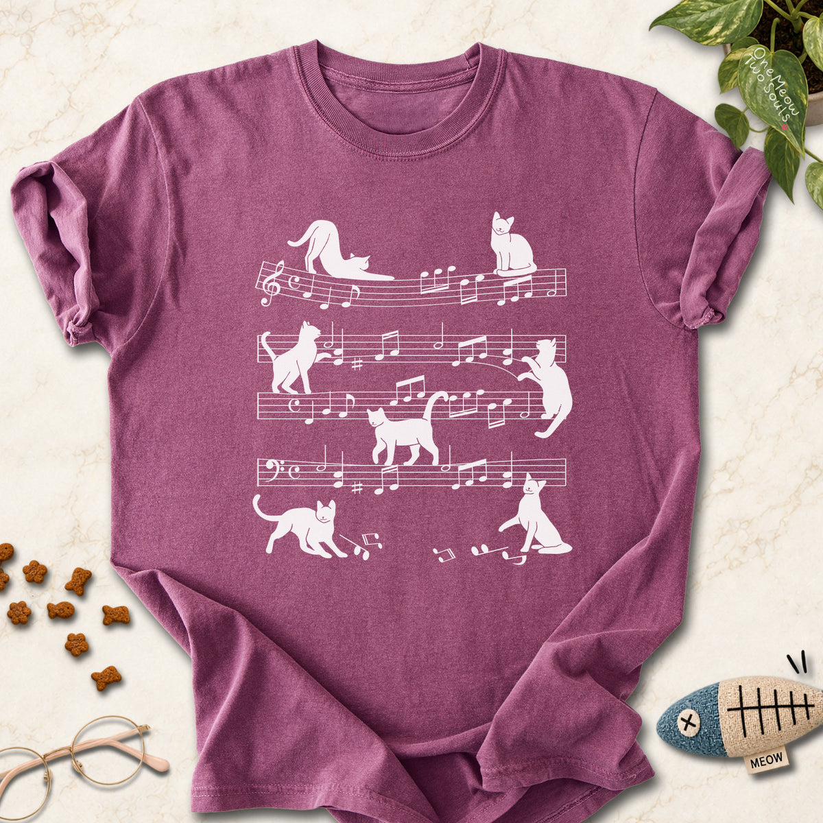Berry colored Comfort Colors 1717 cotton T-shirt, featuring a Cat music sheet funny cat design illustration. One Meow Two Souls brand.