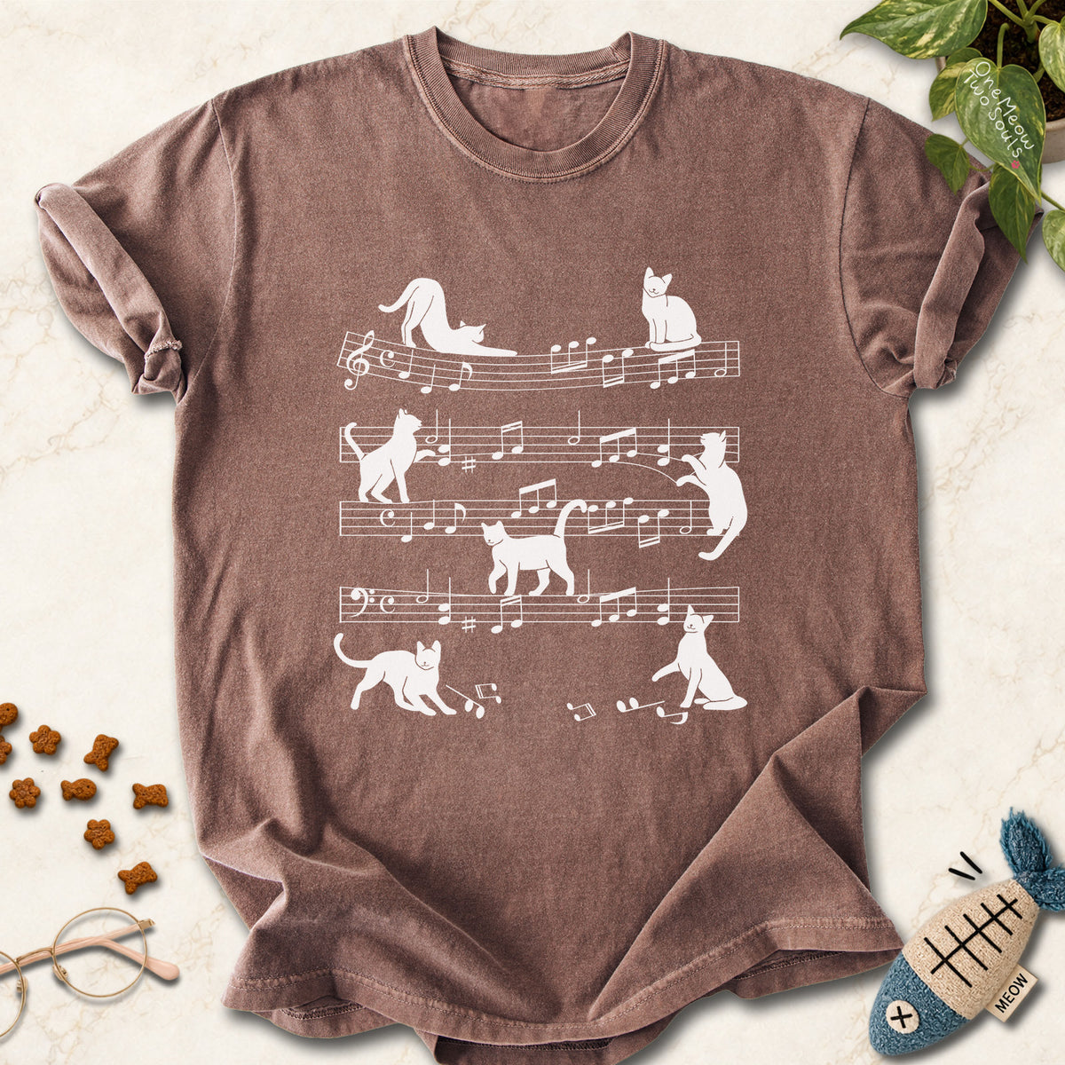 Espresso colored Comfort Colors 1717 cotton T-shirt, featuring a Cat music sheet funny cat design illustration. One Meow Two Souls brand.