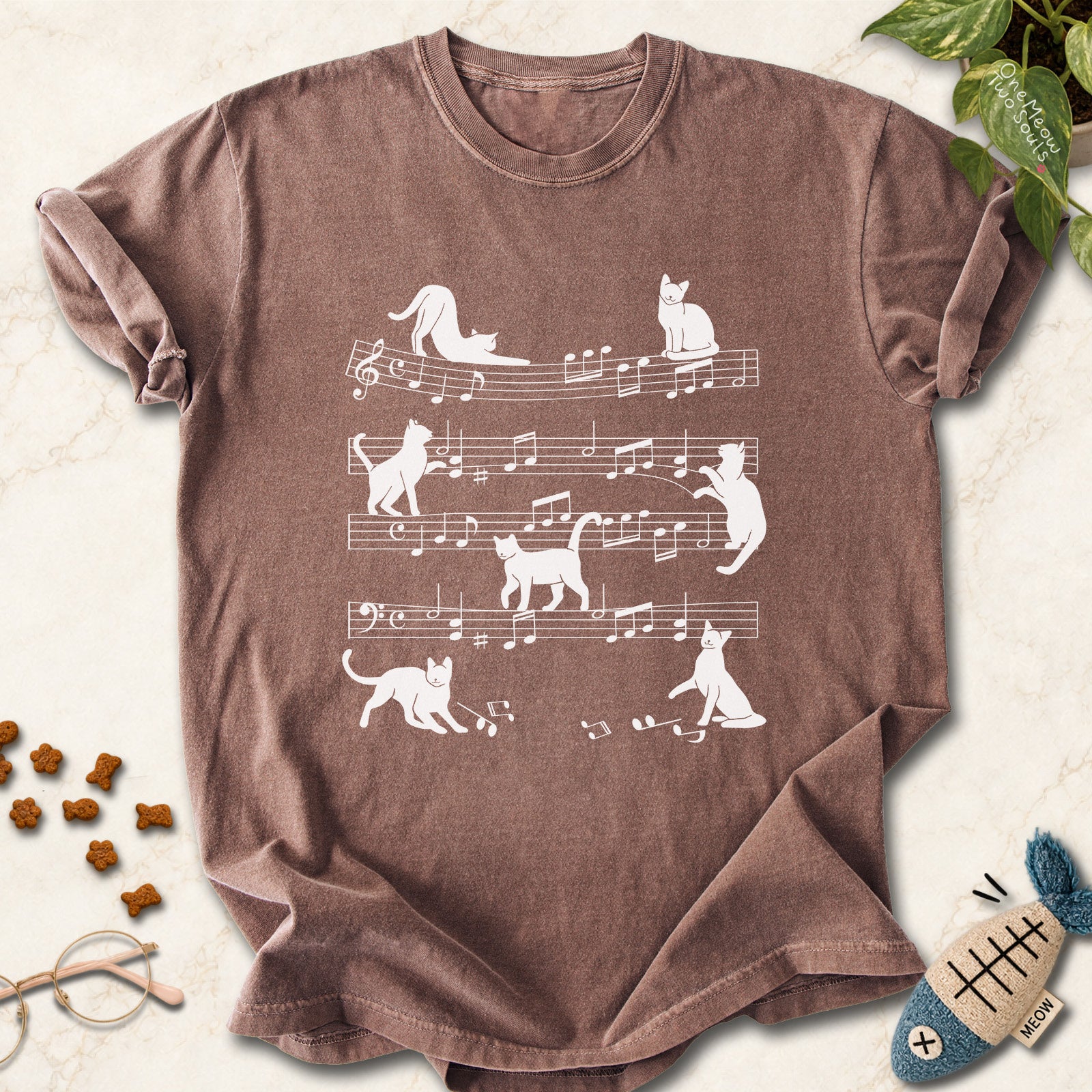 Espresso colored Comfort Colors 1717 cotton T-shirt, featuring a Cat music sheet funny cat design illustration. One Meow Two Souls brand.