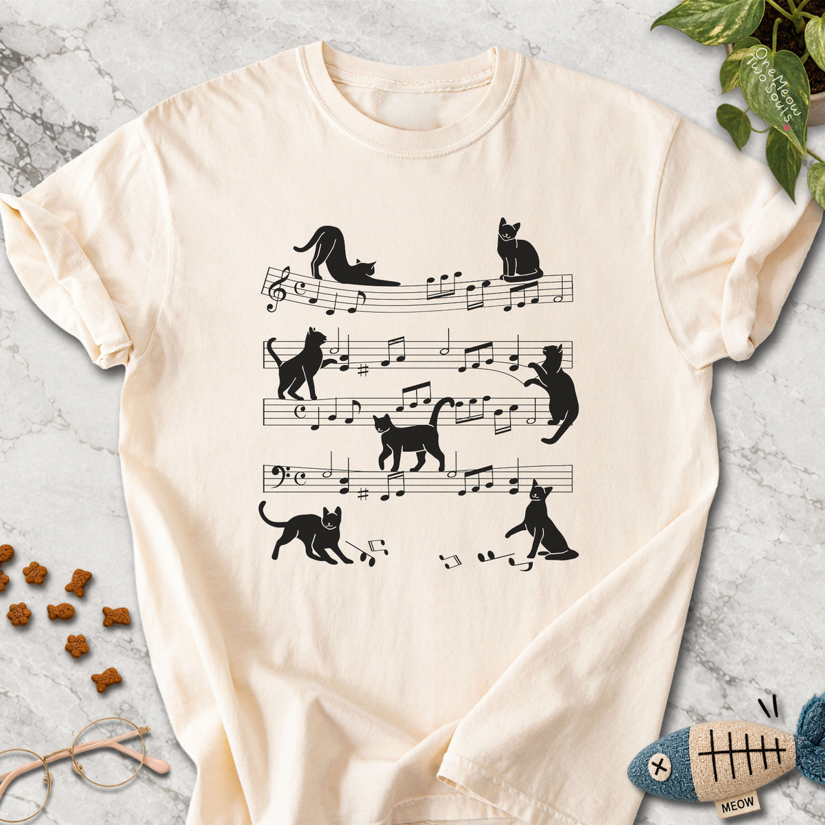 Ivory colored Comfort Colors 1717 cotton T-shirt, featuring a Cat music sheet funny cat design illustration. One Meow Two Souls brand.