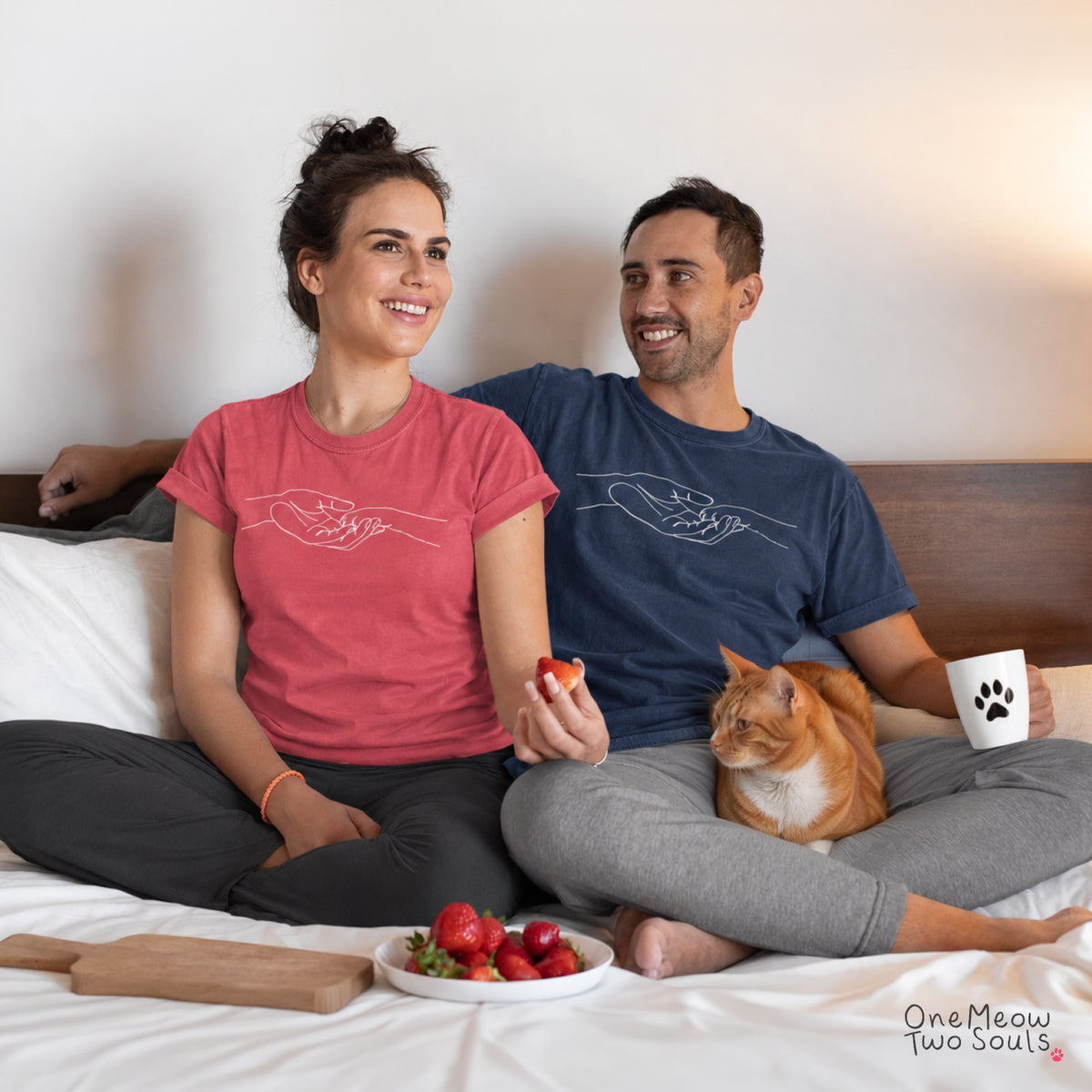 Watermelon and Navy colored Comfort Colors 1717 cotton T-shirt, featuring a cute cat paw and human hand design illustration. One Meow Two Souls brand.