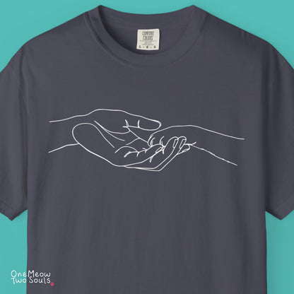 Navy  colored Comfort Colors 1717 cotton T-shirt, featuring a cute cat paw and human hand design illustration. One Meow Two Souls brand.