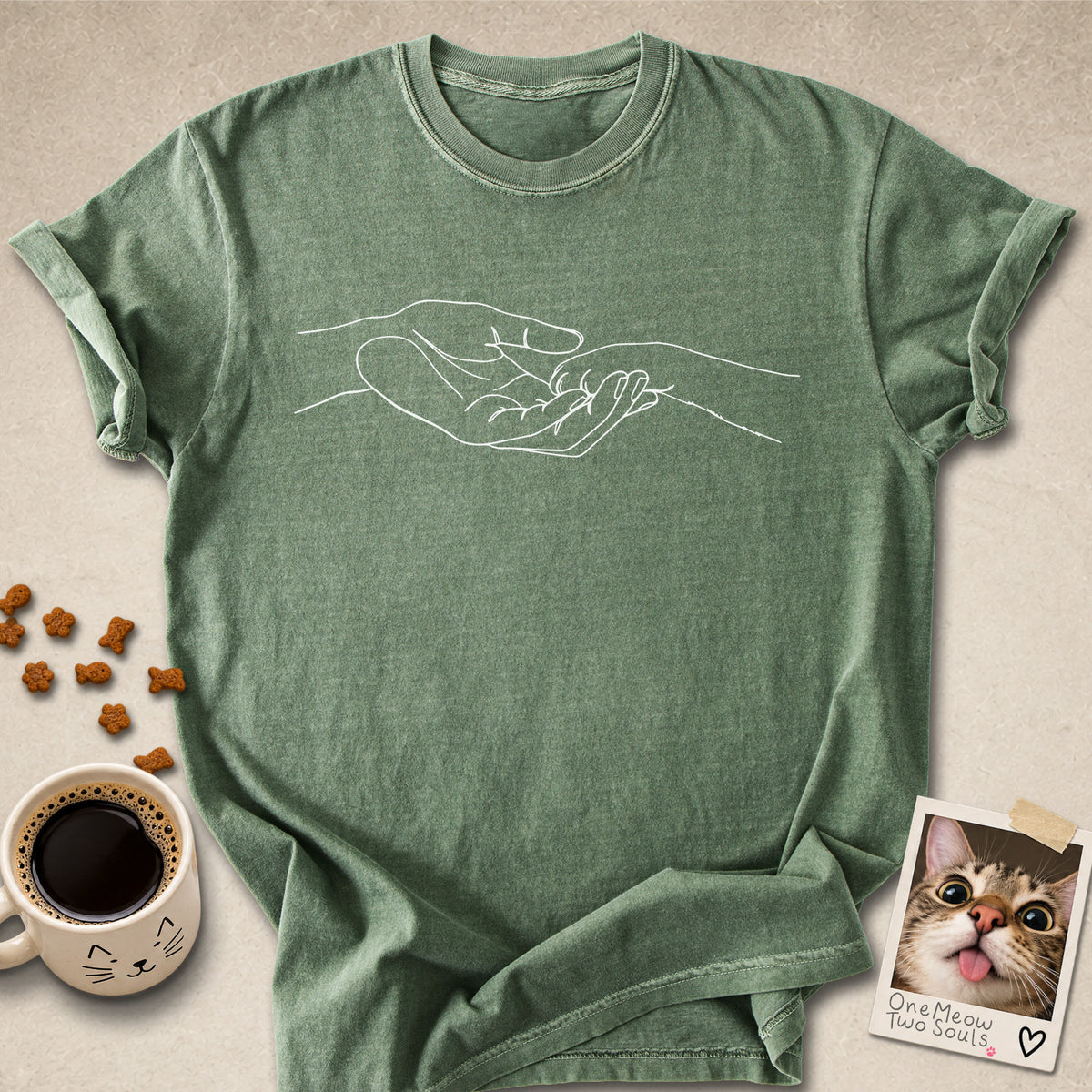 Moss colored Comfort Colors 1717 cotton T-shirt, featuring a cute cat paw and human hand design illustration. One Meow Two Souls brand.
