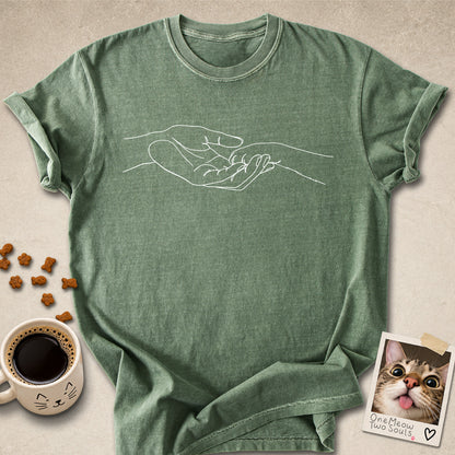 Moss colored Comfort Colors 1717 cotton T-shirt, featuring a cute cat paw and human hand design illustration. One Meow Two Souls brand.
