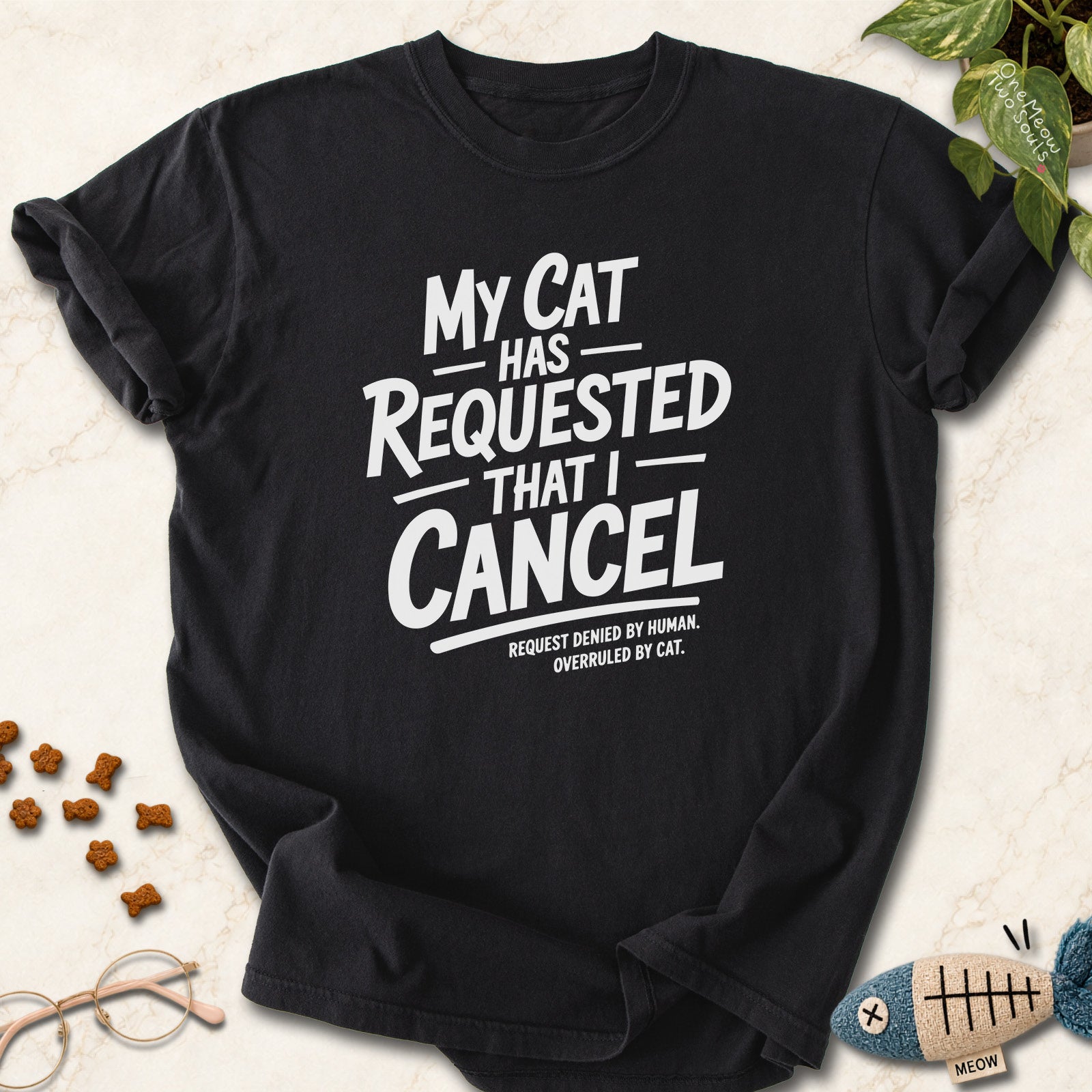 Black colored Comfort Colors 1717 cotton T-shirt, featuring a "My Cat Has Requested That I Cancel" funny cat design illustration. One Meow Two Souls brand.