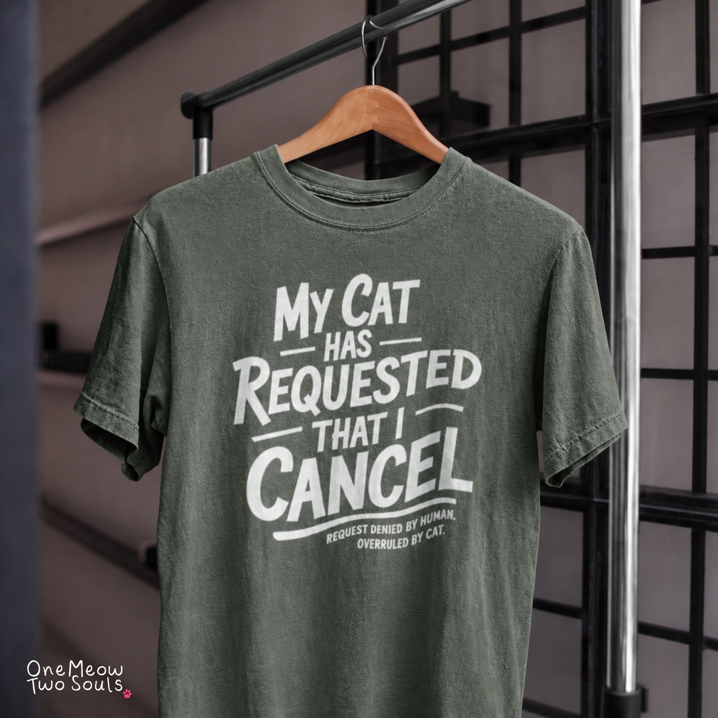 Moss colored Comfort Colors 1717 cotton T-shirt, featuring a "My Cat Has Requested That I Cancel" funny cat design illustration. One Meow Two Souls brand.