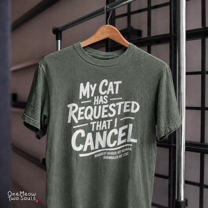 Moss colored Comfort Colors 1717 cotton T-shirt, featuring a "My Cat Has Requested That I Cancel" funny cat design illustration. One Meow Two Souls brand.